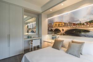 Posteľ alebo postele v izbe v ubytovaní Matteotti Home Verona