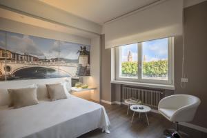 Posteľ alebo postele v izbe v ubytovaní Matteotti Home Verona