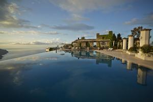 a large pool of water in front of a building at Caruso, A Belmond Hotel, Amalfi Coast in Ravello
