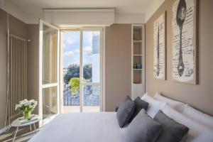 Posteľ alebo postele v izbe v ubytovaní Matteotti Home Verona
