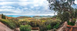 a view of the ocean from a hill at Borgo degli Ulivi in Porto Ercole