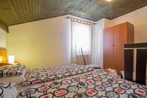 Posteľ alebo postele v izbe v ubytovaní Rea