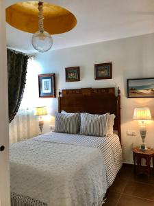 Posteľ alebo postele v izbe v ubytovaní Apartamento con Terraza,a 100m playa Costilla y Frente al Castillo