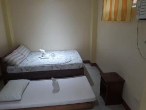 David & Vhie Homestay-David's Guest House房間的床