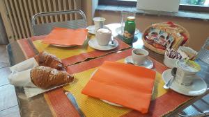 อาหารเช้าซึ่งให้บริการแก่ผู้เข้าพักที่ Locanda B&B Momo