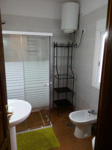 a bathroom with a shower and a toilet and a sink at Casa PESTANA in Fuencaliente de la Palma