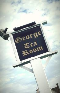 Naktsmītnes The George & Dragon logotips vai norāde