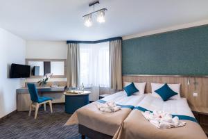Televízia a/alebo spoločenská miestnosť v ubytovaní Krasicki Hotel Resort & Spa