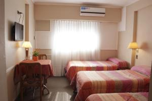 Una cama o camas en una habitación de Hotel Bertaina