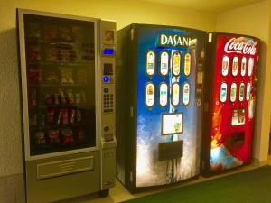 two vending machines are next to each other at New Imperial Inn in Cold Lake