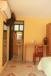 Postel nebo postele na pokoji v ubytování Hotel Puuc