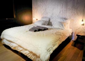 Säng eller sängar i ett rum på Chalet Le Forestier