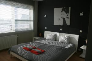 Postel nebo postele na pokoji v ubytování Scheldepunt