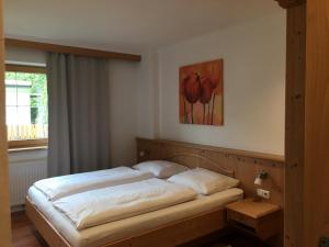 A bed or beds in a room at Appartement Erler