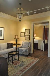 a living room with a couch and a bed at The Inn at Houmas House Estate in Darrow