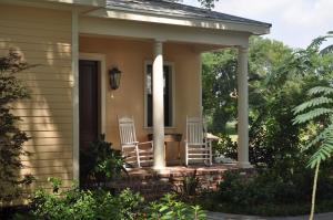 two chairs on a porch of a house at The Inn at Houmas House Estate in Darrow