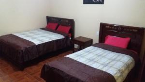 Postel nebo postele na pokoji v ubytování Hotel Navarra