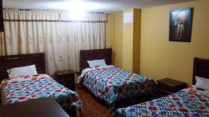 Postel nebo postele na pokoji v ubytování Hotel Navarra