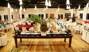 a large banquet hall with a table and chairs at Hotel Henry Morgan All Inclusive in West Bay