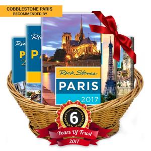 a basket of paris attractions with a year of trust sign at Le Voyage En Isle in Paris