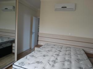 Postel nebo postele na pokoji v ubytování Apartamento Avenida F
