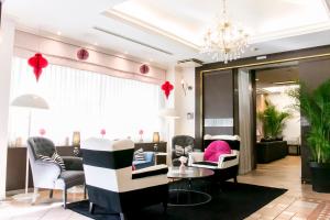 a salon with chairs and a waiting room at Grand Park Hotel Panex Tokyo in Tokyo