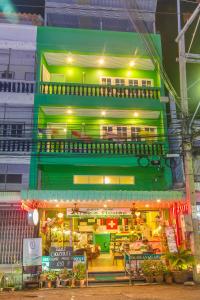 a building with a restaurant in front of it at Aree's House in Hua Hin