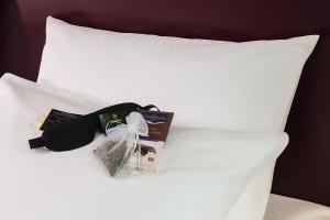 Una cama o camas en una habitación de Mövenpick Hotel Egerkingen