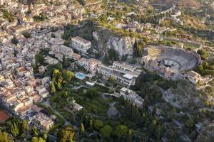 an aerial view of a city filled with lots of tall buildings at Grand Hotel Timeo, A Belmond Hotel, Taormina in Taormina