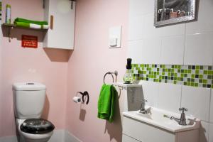 a bathroom with a toilet and a sink at Avoca Park Equestrian Farmstay in Macclesfield +56 photos