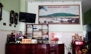 a shop with a sign on the wall above a counter at My My Hotel in Quảng Ngãi