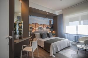 Posteľ alebo postele v izbe v ubytovaní Matteotti Home Verona