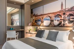 Posteľ alebo postele v izbe v ubytovaní Matteotti Home Verona