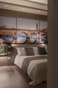 Posteľ alebo postele v izbe v ubytovaní Matteotti Home Verona