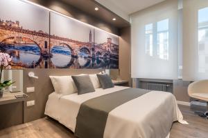 Posteľ alebo postele v izbe v ubytovaní Matteotti Home Verona