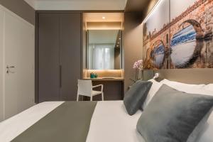 Posteľ alebo postele v izbe v ubytovaní Matteotti Home Verona