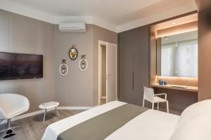 Posteľ alebo postele v izbe v ubytovaní Matteotti Home Verona