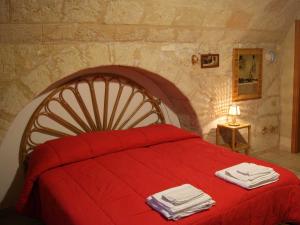 Postel nebo postele na pokoji v ubytování B&B Borgo San Martino