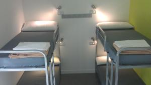 Postel nebo postele na pokoji v ubytování UBA Hostel