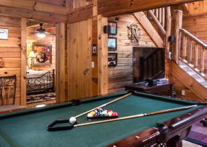 a pool table in a room in a cabin at Mountain Music #19 in Sevierville