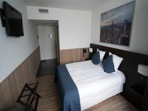 Tempat tidur dalam kamar di Hotel Orchidee