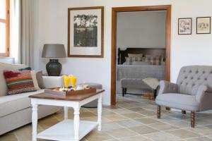 a living room with a couch and a table at Casale Panayiotis in Kalopanayiotis