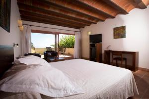 Lova arba lovos apgyvendinimo įstaigoje Hotel Cal Naudi