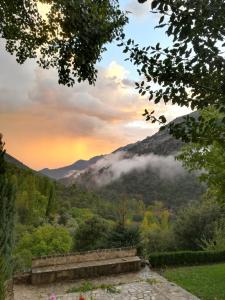 a view of a mountain with clouds in the sky at Saluda Alta in Castril
