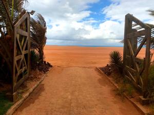 a dirt road in the middle of the desert at Paua Hotel Boutique in Pipa