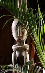 a white stone vase with a plant in it at Paua Hotel Boutique in Pipa
