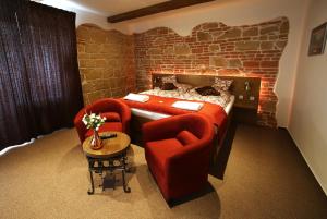 Posteľ alebo postele v izbe v ubytovaní Apartments & Suites Žlutá Hruška