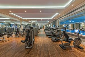 a gym with rows of treadmills and elliptical machines at Elite World Istanbul Florya in Istanbul