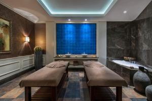 a bathroom with a tub and a large window at Elite World Istanbul Florya in Istanbul