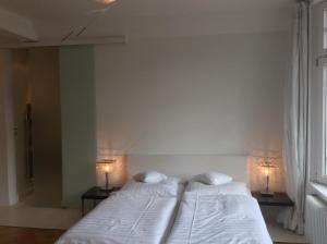 Postel nebo postele na pokoji v ubytování Hotel Heidelberg Astoria